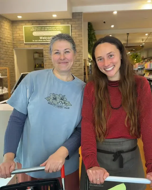 Lauren and Mon with trolleys of their staff picks